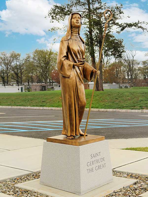 >Saint Gertrude, bronze sculpture created by Progetto Arte Pol