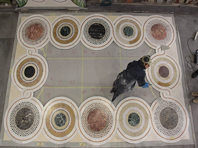 Making of a marble flooring with cosmatesque motive