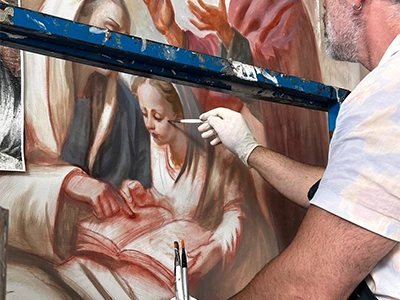 Detail of an artist painting on canva