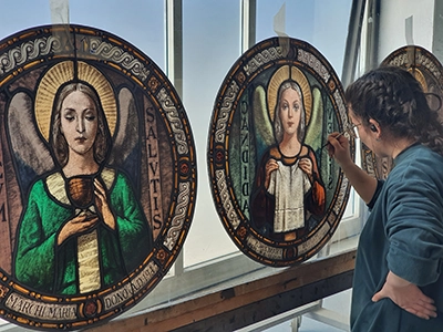 Detail of the restoration of the grisaille of a stained glass window